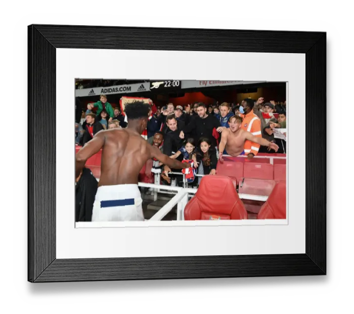 Framed Print : Arsenal Star Sambi Ljubicic Gifts Shirt to Young Fan Amidst Excitement of Arsenal v Aston Villa Match Framed Print : Arsenal Star Sambi Ljubicic Gifts Shirt to Young Fan Amidst Excitement of Arsenal v Aston Villa Match