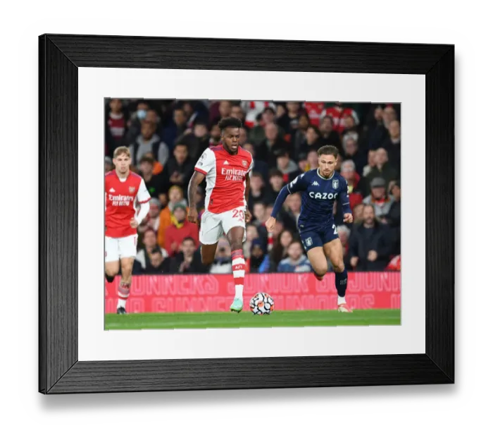 Framed Print : Arsenal's Nuno Tavares Outmaneuvers Aston Villa's Matty Cash in Premier League Clash