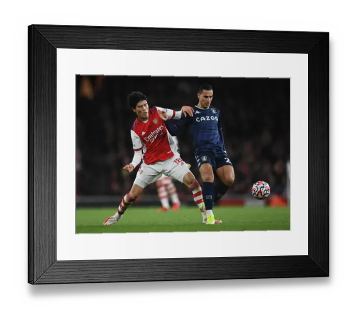 Framed Print : Arsenal vs Aston Villa: Tomiyasu vs El Ghazi - Premier League Clash at Emirates Stadium