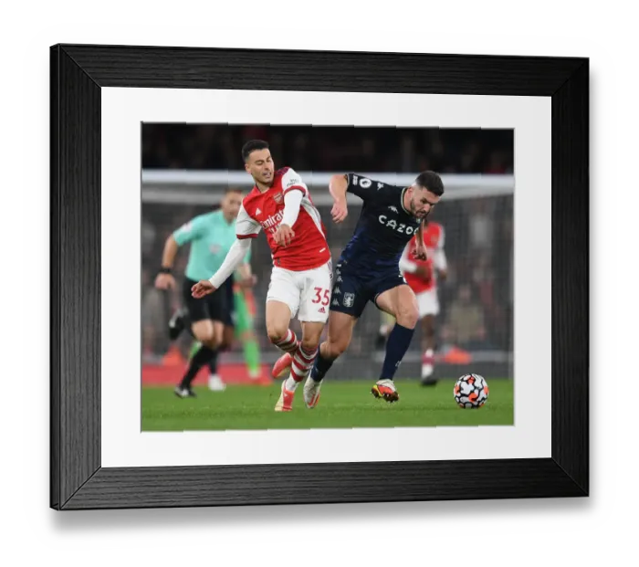 Framed Print : Arsenal vs Aston Villa: Gabriel Martinelli Clashes with John McGinn in Intense Premier League Showdown