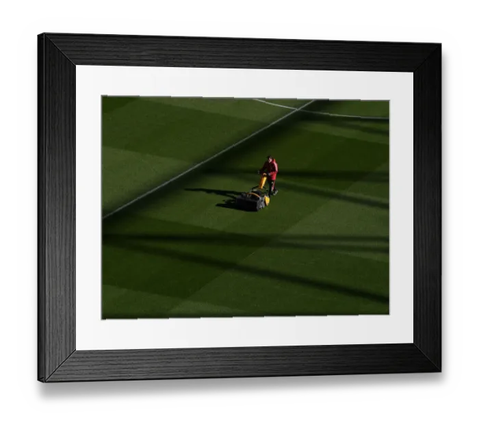 Framed Print : Arsenal: Groundsmen Prepare for Arsenal v Aston Villa at Emirates Stadium