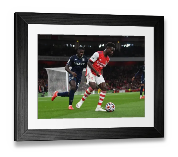 Framed Print : Saka vs. Tuanzebe: A Premier League Battle at Emirates Stadium Framed Print : Saka vs. Tuanzebe: A Premier League Battle at Emirates Stadium