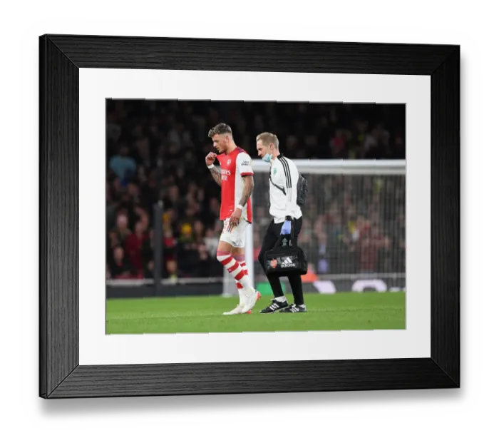 Framed Print : Arsenal's Jordan Reece Tends to Injured Ben White vs Leeds United in Carabao Cup Framed Print : Arsenal's Jordan Reece Tends to Injured Ben White vs Leeds United in Carabao Cup