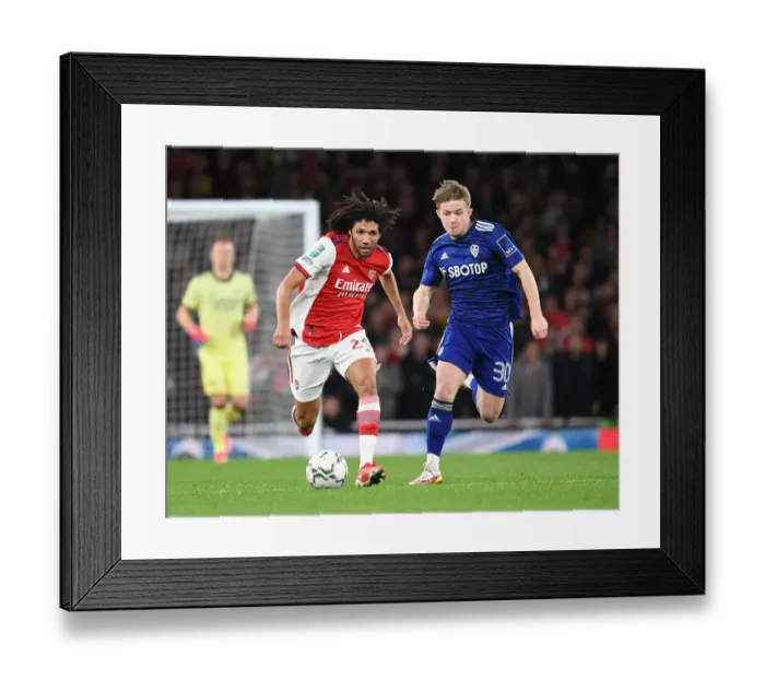 Framed Print : Arsenal's Mo Elneny Outmaneuvers Leeds Joe Gelhardt in Carabao Cup Showdown Framed Print : Arsenal's Mo Elneny Outmaneuvers Leeds Joe Gelhardt in Carabao Cup Showdown