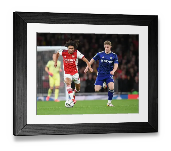 Framed Print : Arsenal's Elneny Outmaneuvers Leeds Gelhardt in Carabao Cup Clash