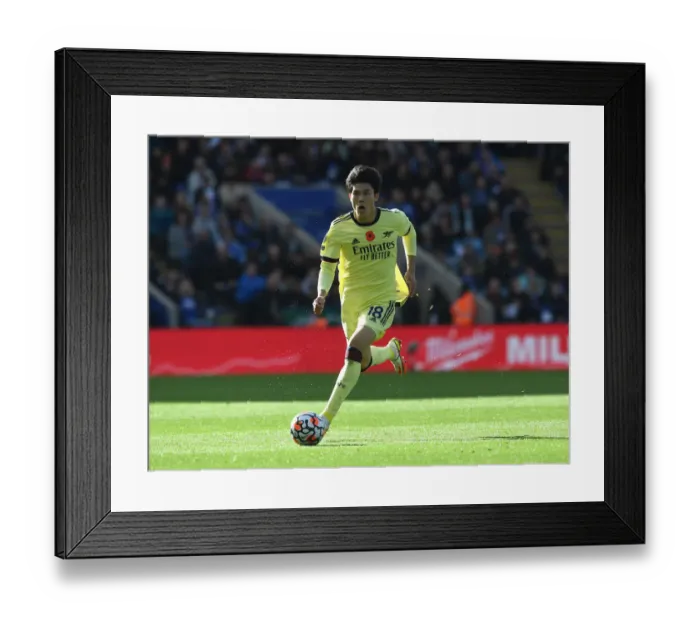 Framed Print : Tomiyasu vs Leicester: Intense Showdown in the Premier League