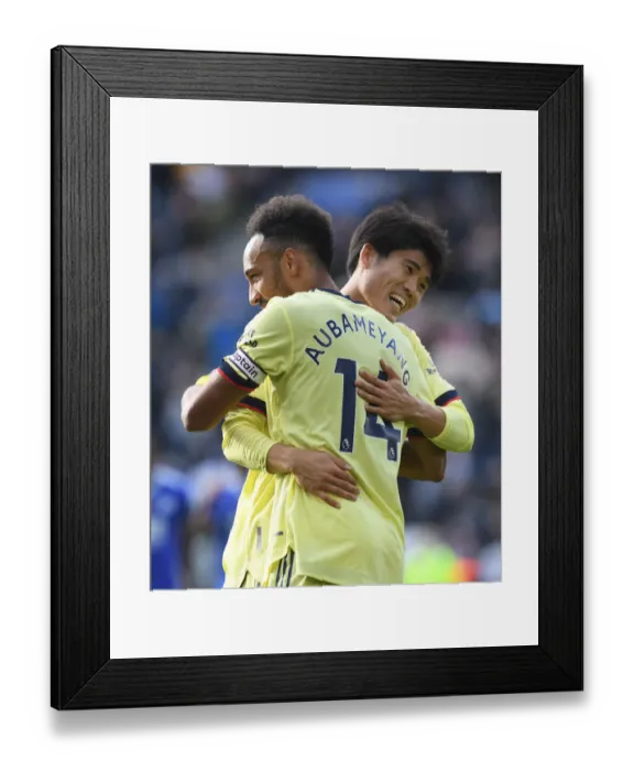 Framed Print : Aubameyang and Tomiyasu Embrace: Leicester City vs. Arsenal, 2021-22 Premier League