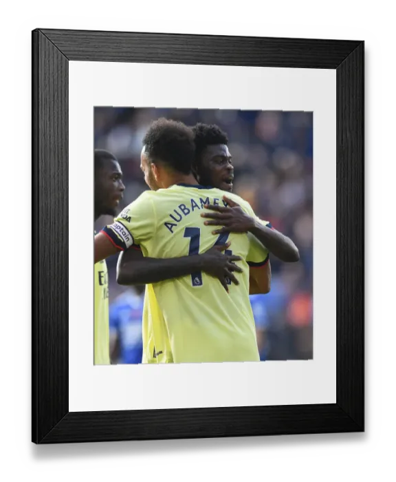 Framed Print : Arsenal's Emotional Reunion: Thomas Partey and Pierre-Emerick Aubameyang Hug it Out After Leicester City Victory