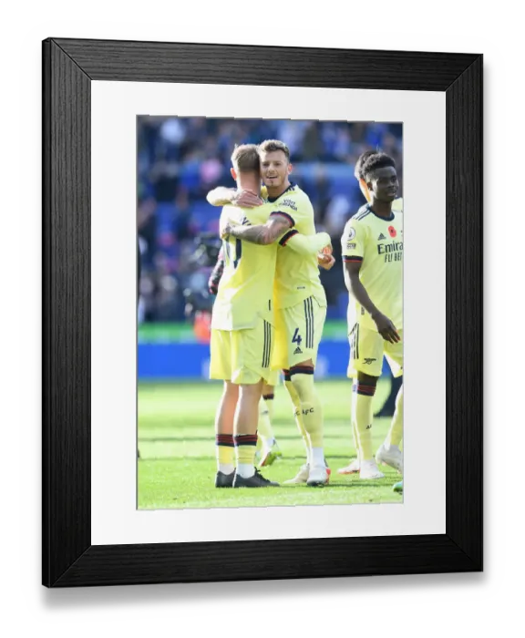 Framed Print : Arsenal's Emile Smith Rowe and Ben White Celebrate Victory Over Leicester City in Premier League
