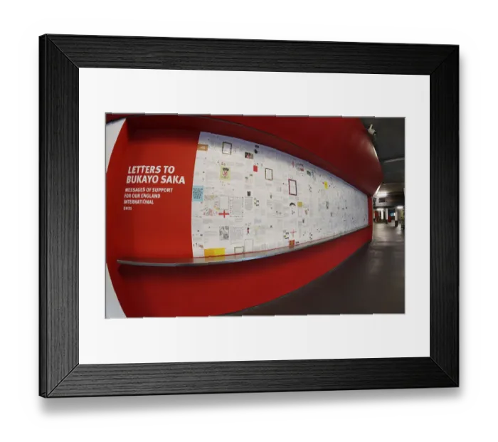 Framed Print : Sea of Support: Arsenal Fans Rally Behind Bukayo Saka Ahead of Arsenal vs. Watford Match