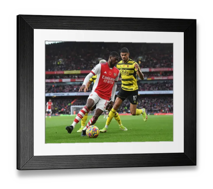 Framed Print : Arsenal vs. Watford: Ainsley Maitland-Niles Holds Off Ashley Fletcher in Premier League Clash Framed Print : Arsenal vs. Watford: Ainsley Maitland-Niles Holds Off Ashley Fletcher in Premier League Clash