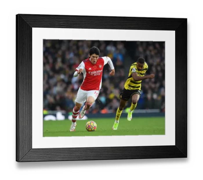 Framed Print : Arsenal vs. Watford: Tomiyasu vs. Dennis Clash in Premier League Showdown
