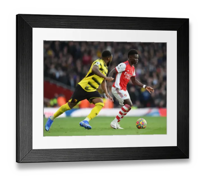 Framed Print : Arsenal's Bukayo Saka Faces Off Against Watford's Danny Rose in Premier League Clash Framed Print : Arsenal's Bukayo Saka Faces Off Against Watford's Danny Rose in Premier League Clash