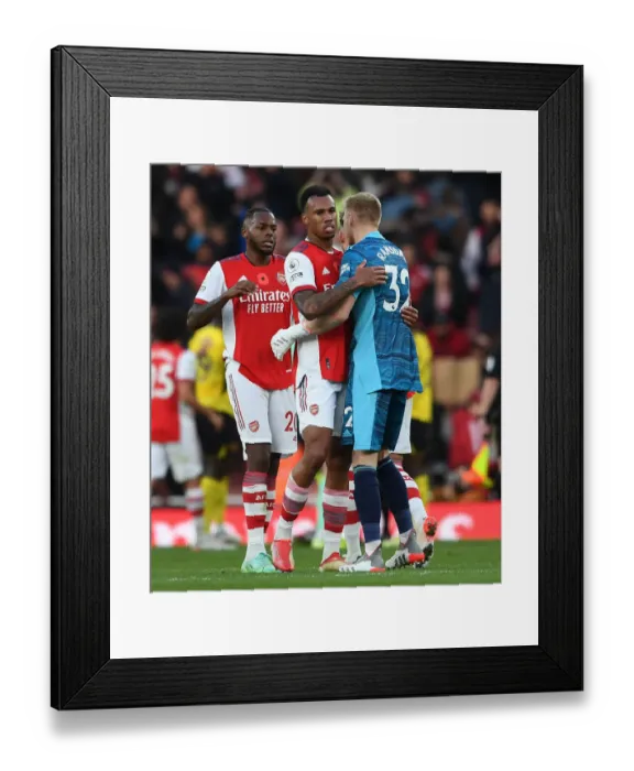 Framed Print : Arsenal: Magalhaes and Ramsdale Embrace Victory After Arsenal v Watford (2021-22)