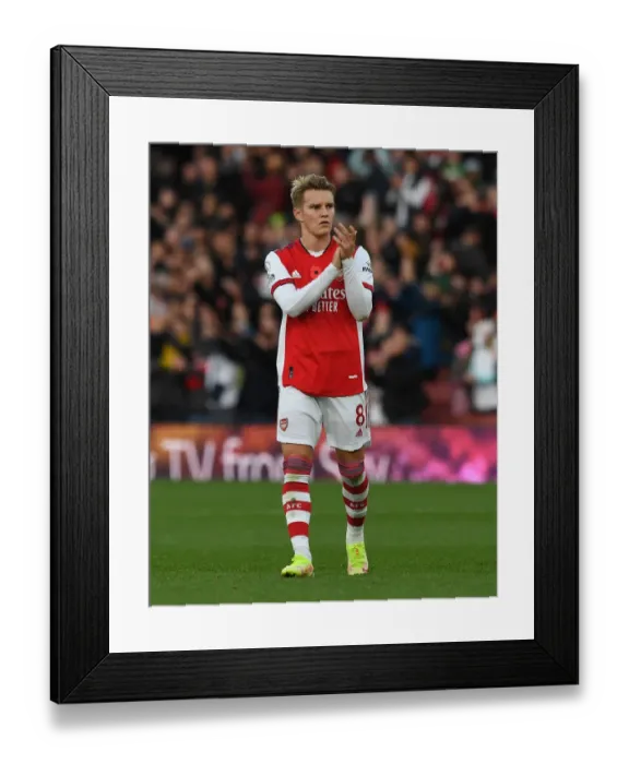 Framed Print : Arsenal's Martin Odegaard Celebrates with Fans after Arsenal v Watford Win Framed Print : Arsenal's Martin Odegaard Celebrates with Fans after Arsenal v Watford Win