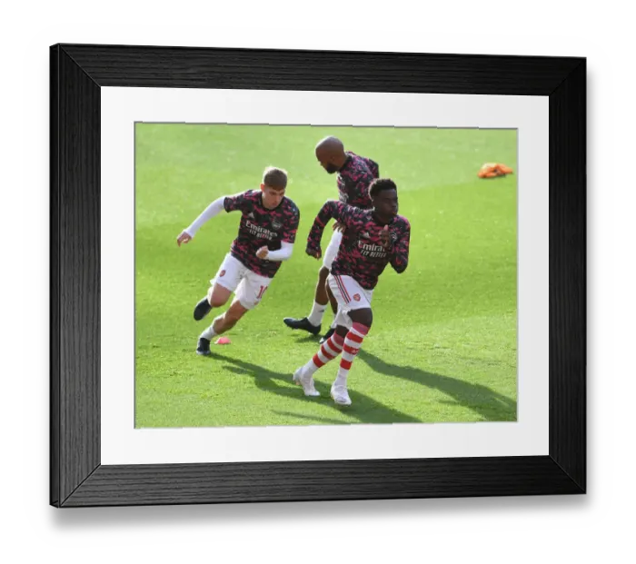 Framed Print : Arsenal Players Bukayo Saka and Emile Smith Rowe Warm Up Ahead of Arsenal v Watford (2021-22)
