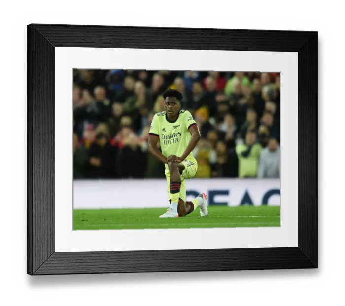 Framed Print : Arsenal's Sambi Lokonga Kneels During Liverpool vs Arsenal Premier League Match (2021-22) Framed Print : Arsenal's Sambi Lokonga Kneels During Liverpool vs Arsenal Premier League Match (2021-22)