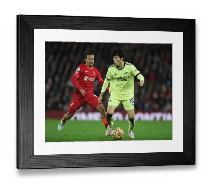 Framed Print : Clash at Anfield: Tomiyasu vs. Thiago