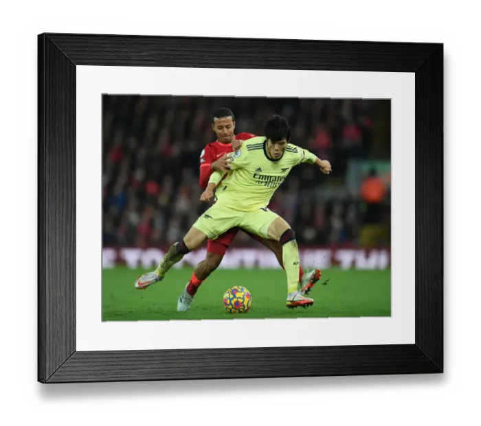 Framed Print : Tomiyasu vs. Thiago: A Premier League Battle at Anfield Framed Print : Tomiyasu vs. Thiago: A Premier League Battle at Anfield