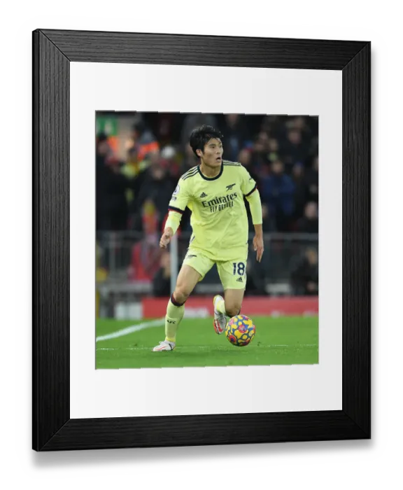 Framed Print : Arsenal's Tomiyasu Stands Strong: A Defiant Performance at Anfield (2021-22)