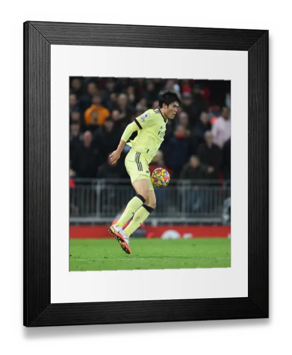 Framed Print : Arsenal's Tomiyasu Faces Off Against Liverpool at Anfield (Premier League 2021-22) Framed Print : Arsenal's Tomiyasu Faces Off Against Liverpool at Anfield (Premier League 2021-22)