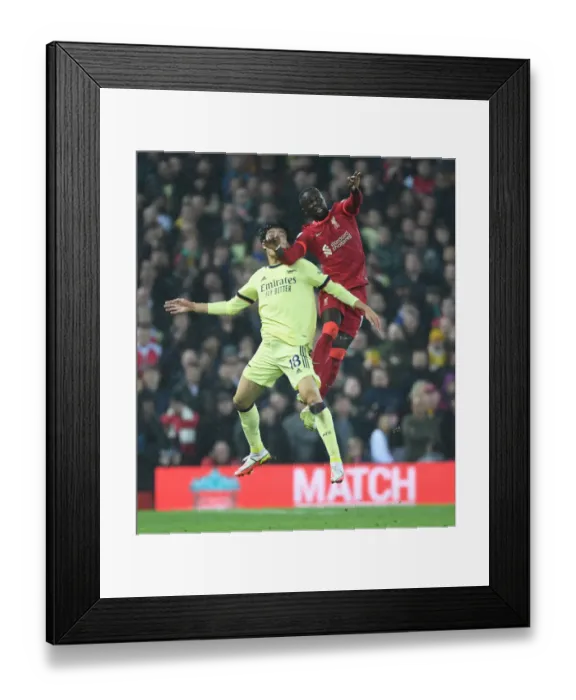 Framed Print : Tomiyasu vs. Mane: A Foul Rivalry - Liverpool vs. Arsenal at Anfield Framed Print : Tomiyasu vs. Mane: A Foul Rivalry - Liverpool vs. Arsenal at Anfield