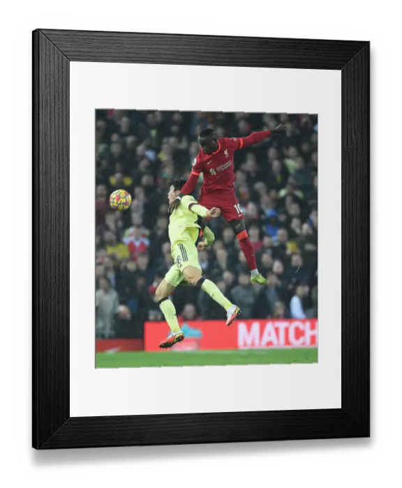 Framed Print : Liverpool vs. Arsenal: Intense Clash as Tomiyasu Fouls Mane