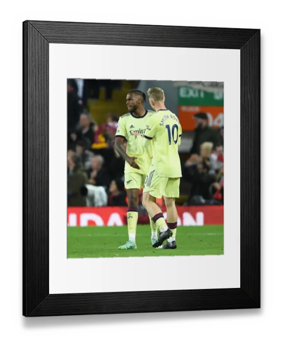 Framed Print : Liverpool's Second Goal: Emile Smith Rowe Consoles Distraught Nuno Tavares Framed Print : Liverpool's Second Goal: Emile Smith Rowe Consoles Distraught Nuno Tavares