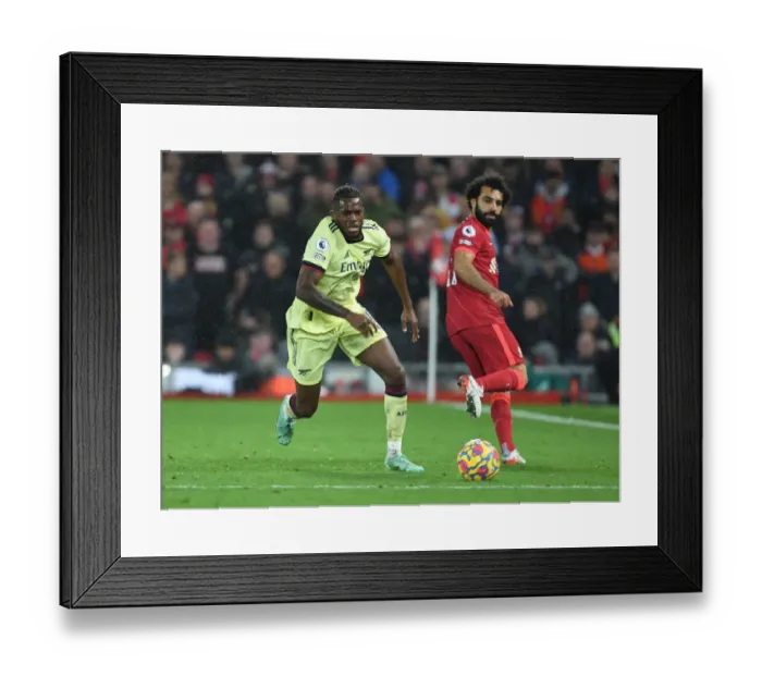Framed Print : Nuno Tavares vs. Mo Salah: Intense Battle at Anfield - Liverpool vs. Arsenal, Premier League 2021-22