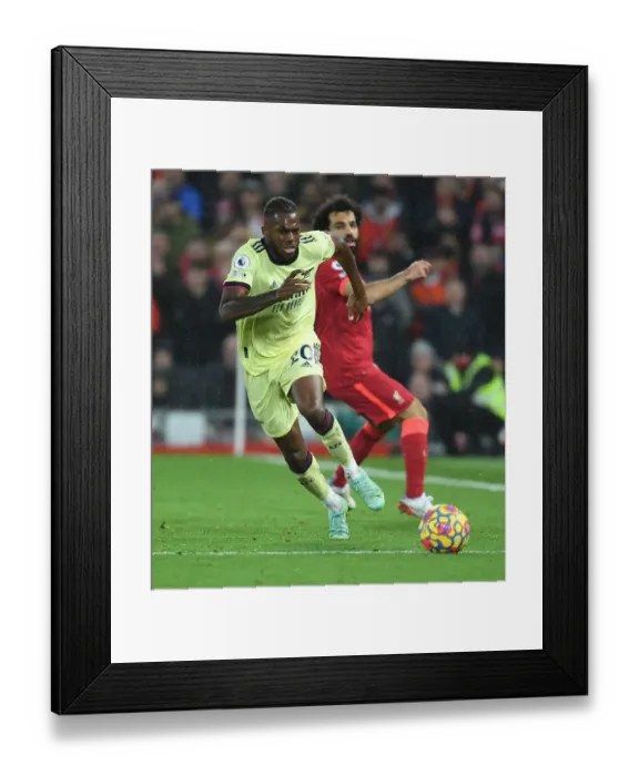 Framed Print : Nuno Tavares vs. Mo Salah: A Battle at Anfield in the Premier League