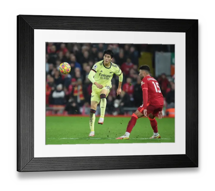 Framed Print : Clash at Anfield: Tomiyasu vs. Oxlade-Chamberlain - Liverpool vs. Arsenal, Premier League 2021-22