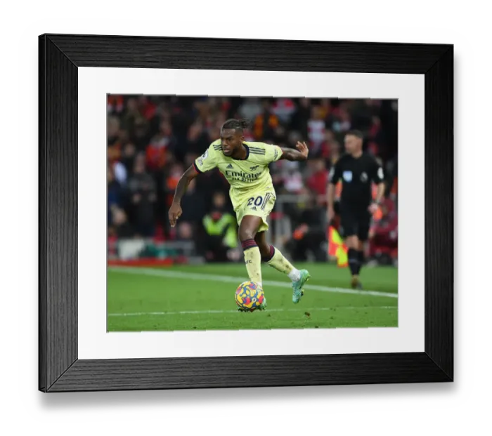 Framed Print : Nuno Tavares Stands Firm: Arsenal's Defensive Hero at Anfield vs. Liverpool, Premier League 2021-22
