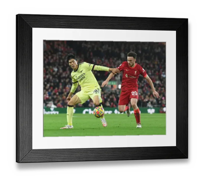 Framed Print : Tomiyasu vs. Jota: A Premier League Showdown at Anfield - Liverpool vs. Arsenal