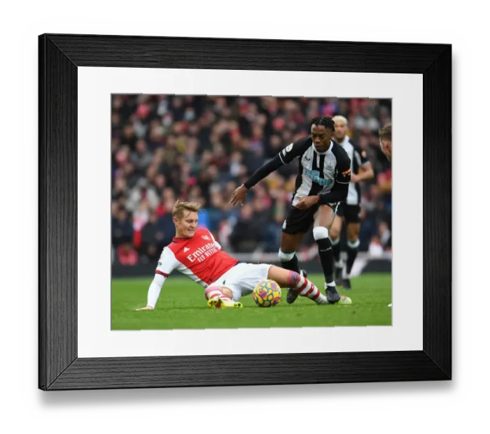 Framed Print : Clash of the Midfield Talents: Odegaard vs. Willock