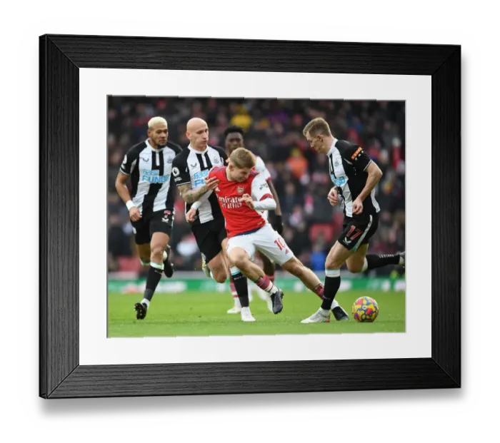 Framed Print : Arsenal's Emile Smith Rowe Faces Off Against Newcastle's Shelvey and Krafth in Premier League Clash