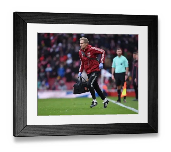 Framed Print : Arsenal's Jordan Reece Attends to Injured Player in Intense Arsenal vs Newcastle United Clash (2021-22) Framed Print : Arsenal's Jordan Reece Attends to Injured Player in Intense Arsenal vs Newcastle United Clash (2021-22)