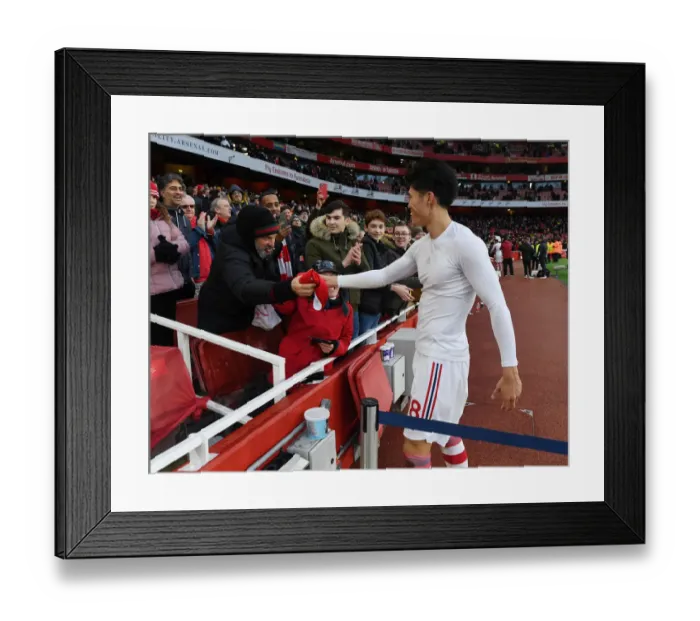 Framed Print : Arsenal's Tomiyasu Gifts Shirt to Ecstatic Fan After Newcastle Victory Framed Print : Arsenal's Tomiyasu Gifts Shirt to Ecstatic Fan After Newcastle Victory