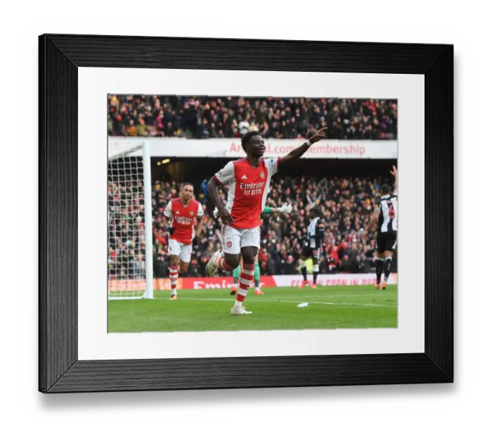 Framed Print : Saka Scores First: Arsenal's Triumph Over Newcastle United in the Premier League 2021-22 Framed Print : Saka Scores First: Arsenal's Triumph Over Newcastle United in the Premier League 2021-22