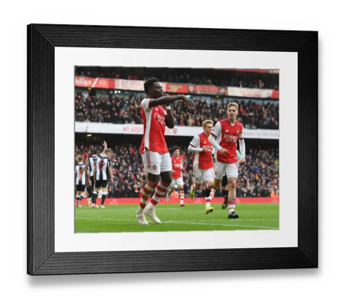 Framed Print : Saka Scores First: Arsenal's Triumph Over Newcastle United in Premier League 2021-22