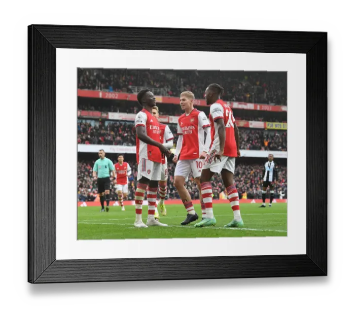 Framed Print : Arsenal's Saka, Smith Rowe, and Tavares Celebrate First Goal vs. Newcastle United (2021-22)