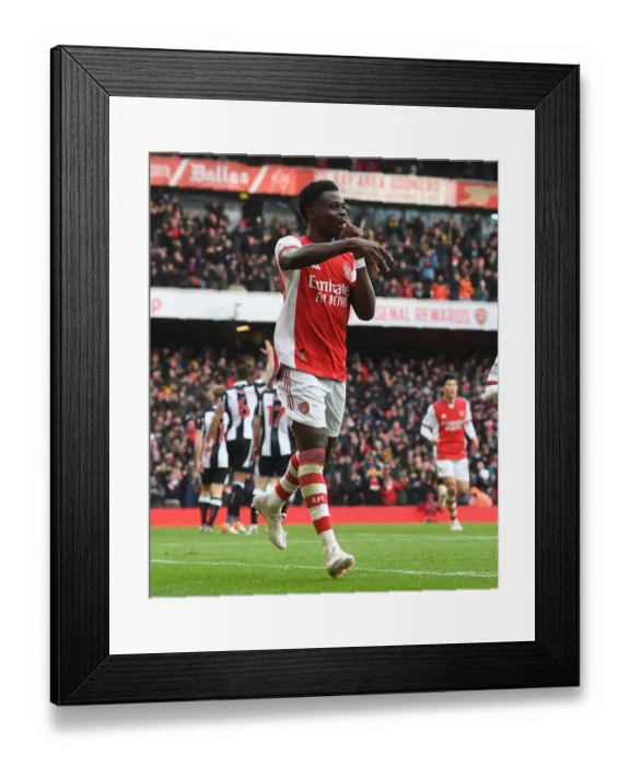 Framed Print : Saka Scores First: Arsenal's Victory over Newcastle United in Premier League Showdown