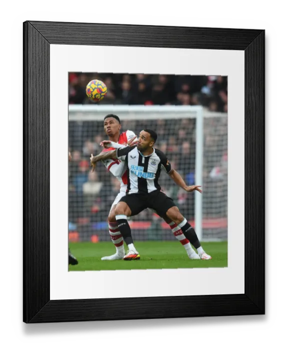 Framed Print : Magalhaes vs Wilson: A Premier League Showdown at Emirates Stadium
