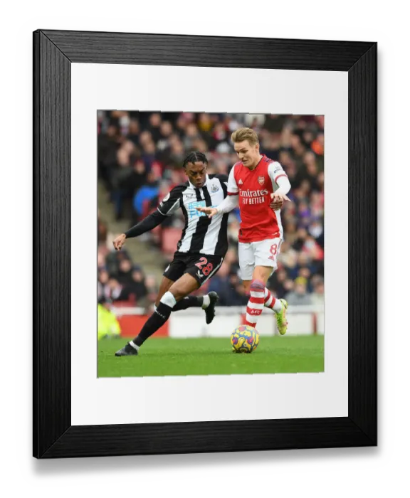 Framed Print : Intense Midfield Rivalry: Odegaard vs. Willock at Emirates Stadium - Arsenal vs. Newcastle United (2021-22) Framed Print : Intense Midfield Rivalry: Odegaard vs. Willock at Emirates Stadium - Arsenal vs. Newcastle United (2021-22)