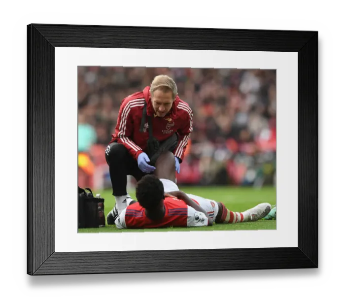 Framed Print : Arsenal's Jordan Reece Tends to Injured Bukayo Saka during Arsenal v Newcastle United (2021-22) Framed Print : Arsenal's Jordan Reece Tends to Injured Bukayo Saka during Arsenal v Newcastle United (2021-22)