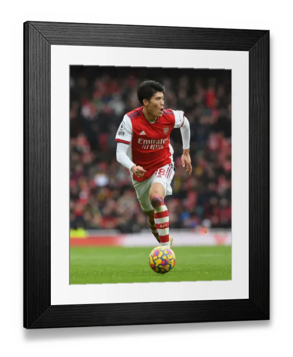 Framed Print : Arsenal's Tomiyasu in Action Against Newcastle United - Premier League 2021-22 Framed Print : Arsenal's Tomiyasu in Action Against Newcastle United - Premier League 2021-22