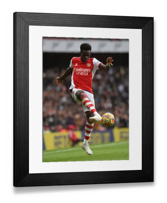 Framed Print : Arsenal's Bukayo Saka Dazzles in Premier League Showdown vs. Newcastle United