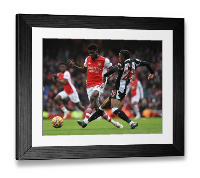 Framed Print : Arsenal's Partey Fends Off Willock in Intense Arsenal v Newcastle Clash Framed Print : Arsenal's Partey Fends Off Willock in Intense Arsenal v Newcastle Clash