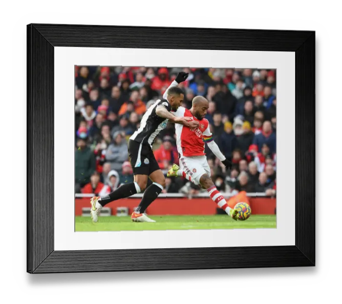 Framed Print : Arsenal vs Newcastle United: Lacazette vs Lascelles Clash in Premier League Showdown