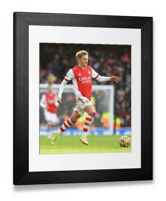 Framed Print : Martin Odegaard's Standout Display: Arsenal Triumphs Over Newcastle United in Premier League Clash