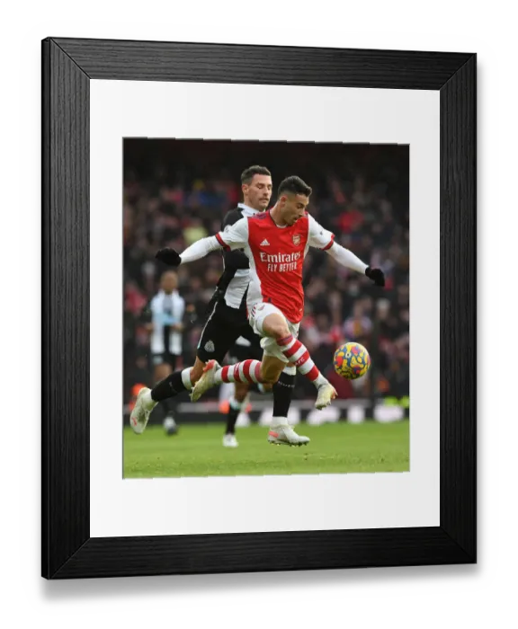 Framed Print : Arsenal's Martinelli Battles Schar in Premier League Clash vs. Newcastle